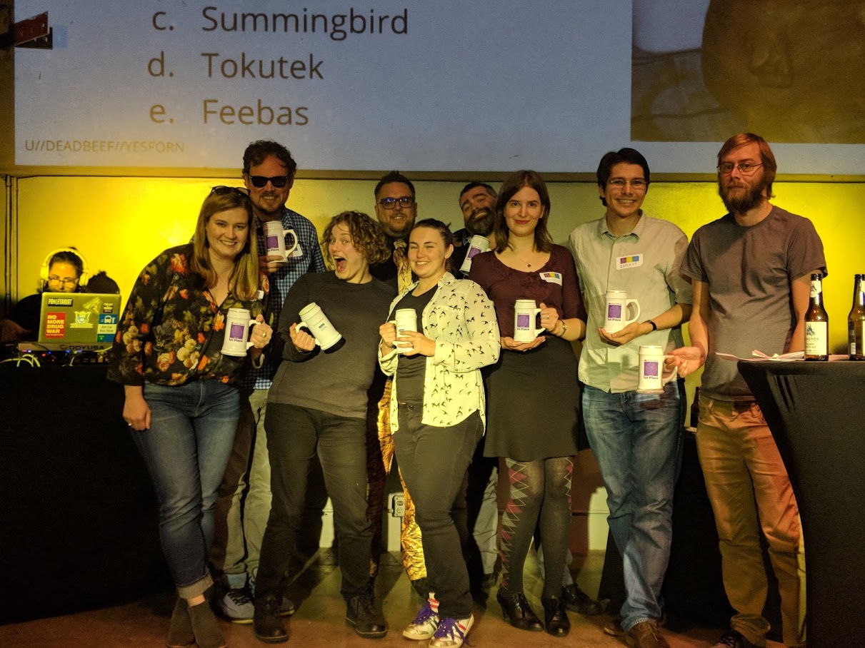 We WON!!!! Our 1st Place team, U+1F984, on-stage with our emcee, CooperQ.