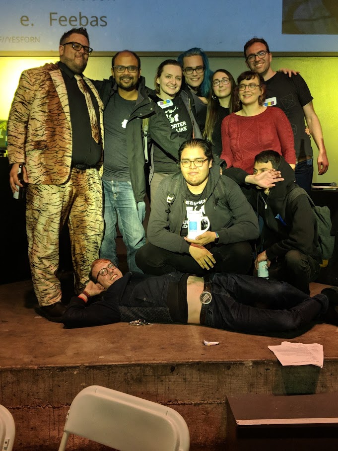 We'll get you next year! Our 3rd place team, Trash Cats, on-stage with our emcee, CooperQ.